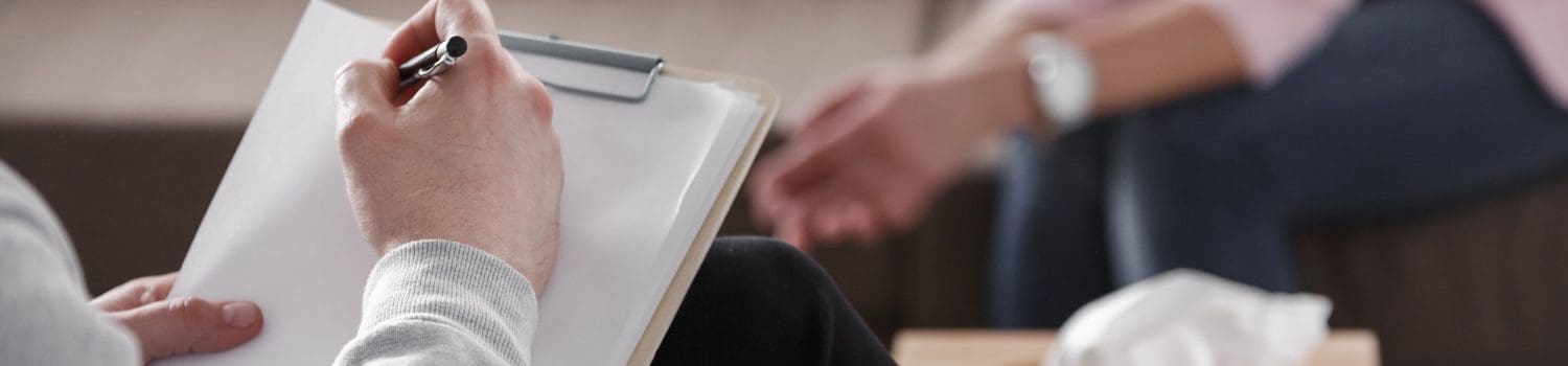 Therapist using CBT to help depressed client within a counselling session. Therapist using CBT to help depressed client within a counselling session.