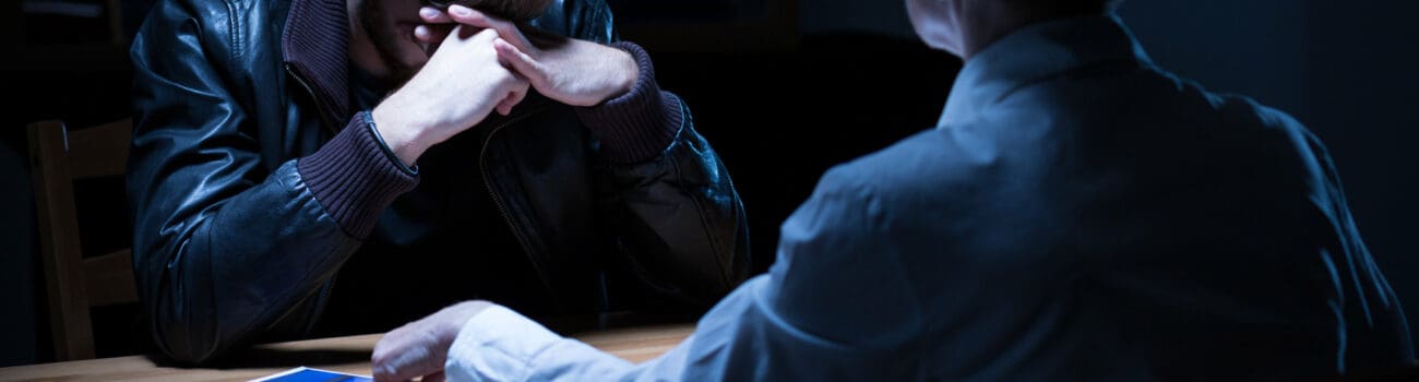 Detective interviewing suspect Detective interviewing suspect